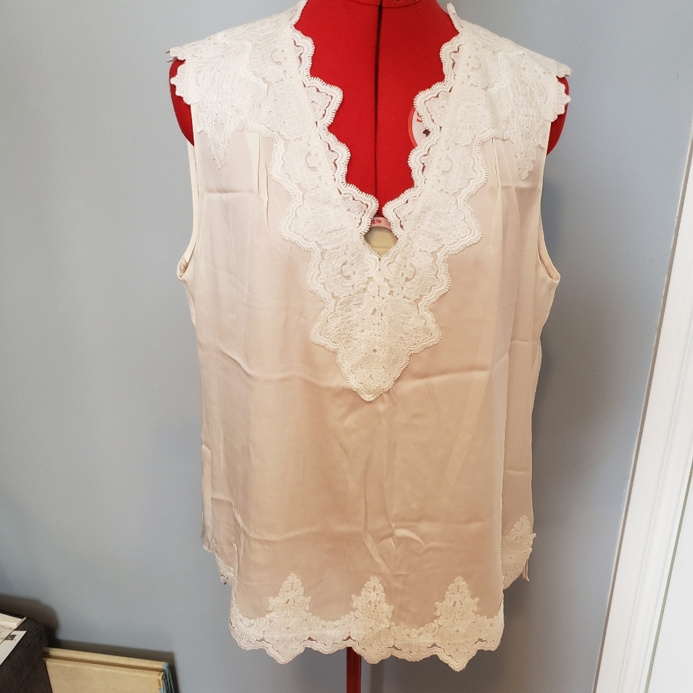 White silk sleeveless blouse